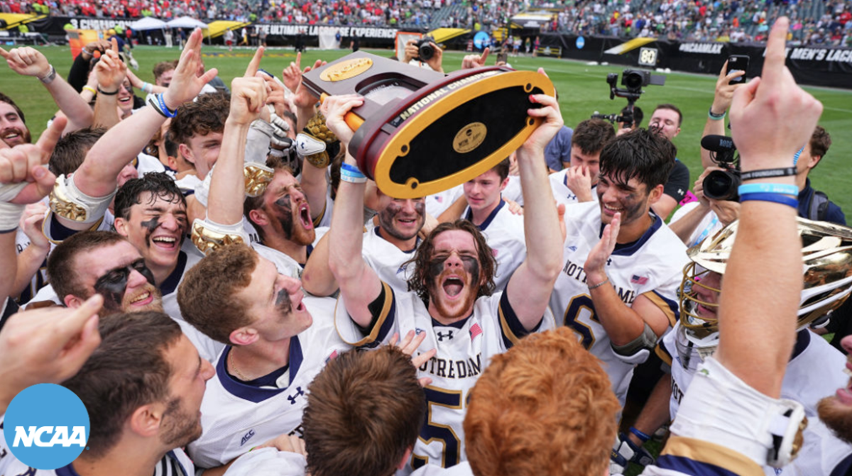 Pat Kavanaugh hoists the national championship trophy after beating Maryland 15-5 in his last year with Notre Dame.